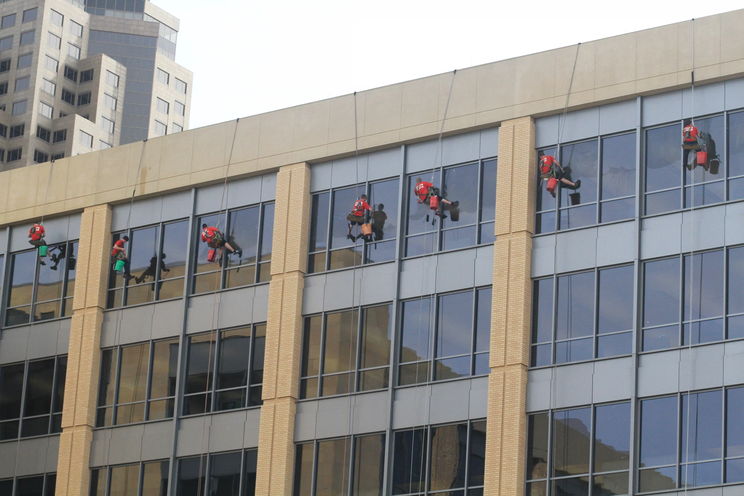 High rise window cleaners cleaning windows in Des Moines, Iowa