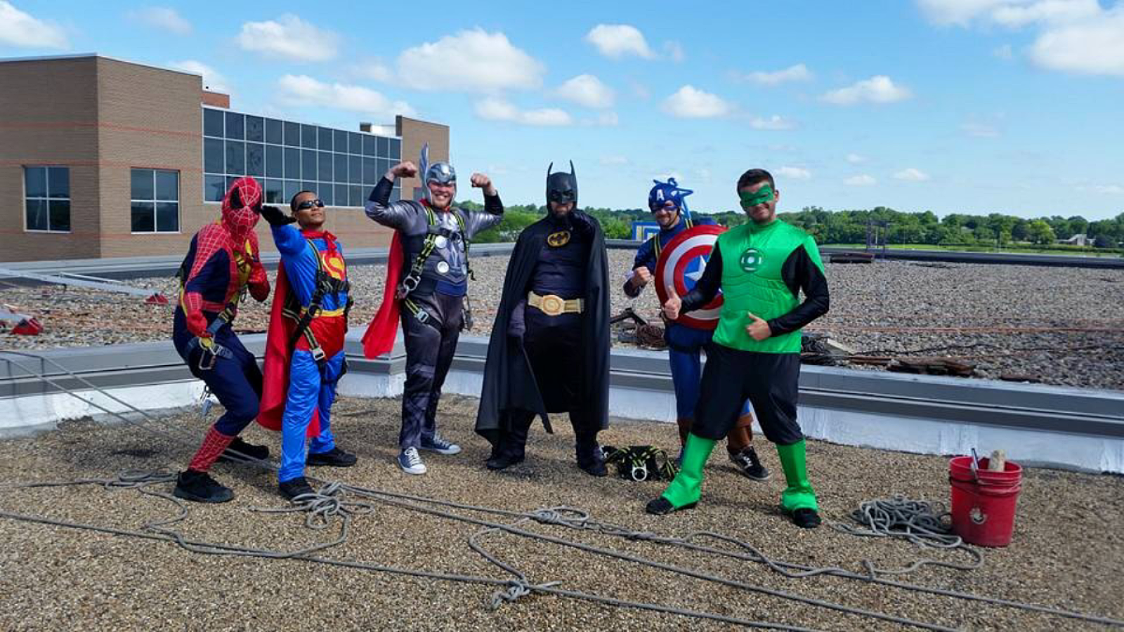 window cleaners dressed as super heroes at children's hospital